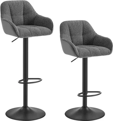 Two grey bar stools are shown against a white background. They are identical in design, with plush, tufted seats and a minimalist base.