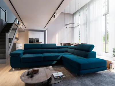 A modern living room with a large sectional sofa, dining area, and staircase.