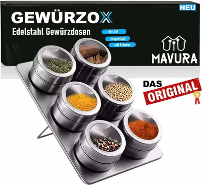 A set of magnetic spice containers on a stand, with a box in the background.