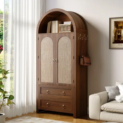 A wooden cabinet with woven doors and drawers, placed in a room next to a window and a sofa.