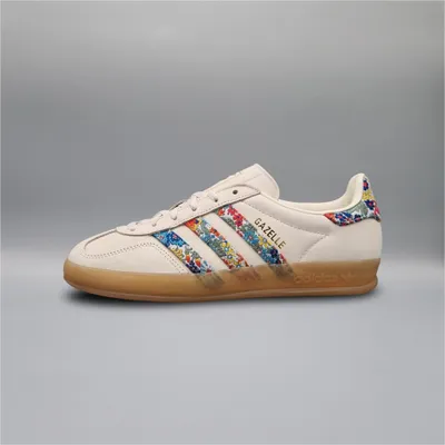 A single Adidas Gazelle shoe is shown against a plain gray background.