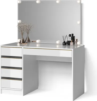 A white vanity table with a large mirror and LED lights, featuring drawers and a shelf, with decorative items on top.