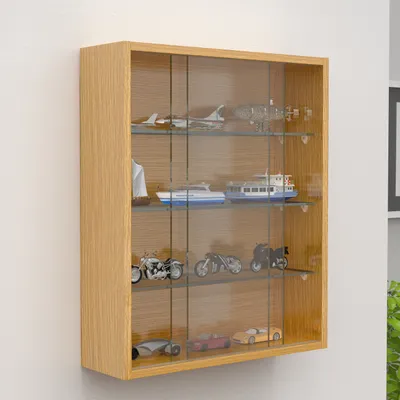 A wooden display cabinet with glass doors mounted on a white wall, showcasing various miniature models.