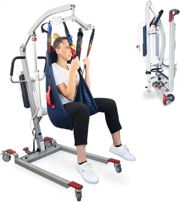 A woman is seated in a patient lift, which is a medical device used for transferring individuals. The lift is shown in a studio setting with a white background.