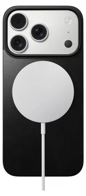 A black iPhone case with a white MagSafe charger attached.