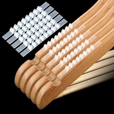 Immagine prodotto di Grucce in silicone trasparenti con inserti antiscivolo - 100 pezzi - Adatte per ganci in legno e plastica - Dimensioni: 7 x 0,7 cm - Grucce per abiti