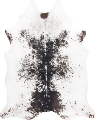 A cowhide rug is shown from a top-down perspective on a white background.