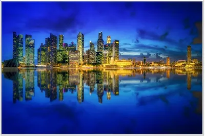 Produktbild von Wallario Wandbild Skyline von Singapur in der Abenddämmerung, Größe: 61 x 91,50 cm, Poster mit weißem Aluminiumrahmen
