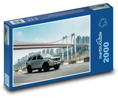 Produktbild von martinpuzzle - Puzzle 2000 Teile - SUV-Auto in der Stadt