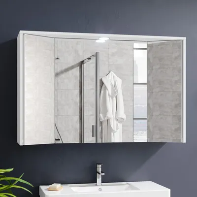 A white bathroom cabinet with mirrored doors is mounted above a sink.
