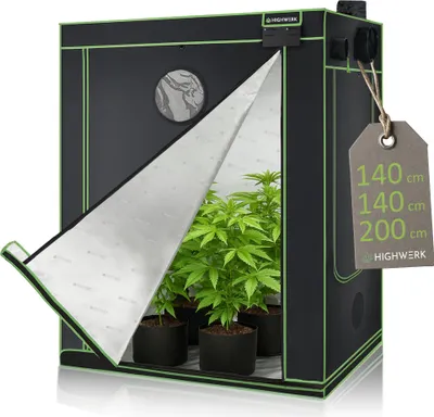 A black and green grow tent is shown with its front flap open, revealing several potted plants inside. A price tag with dimensions is attached to the side.