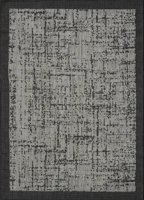 A flat lay of a rug with an abstract pattern.