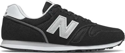 A side view of a black New Balance sneaker.