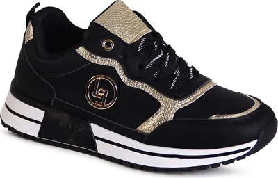 A studio shot of a single black and gold sneaker.