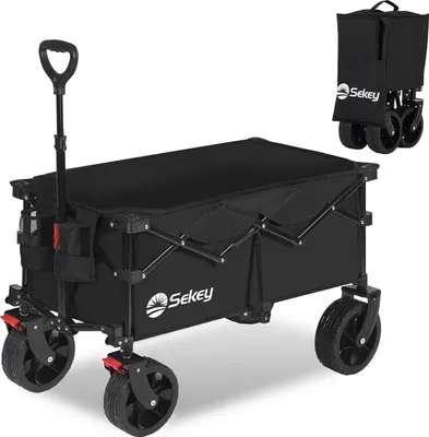 A black folding wagon with a handle and wheels, shown from a slightly angled front view. A smaller, folded version of the wagon is shown in the upper right corner.