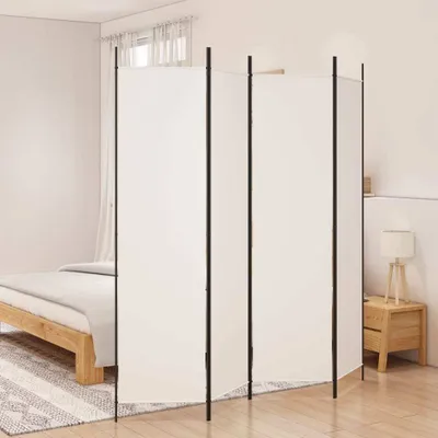 A room divider is set up in a bedroom next to a bed.