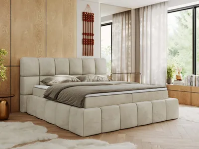 A bedroom scene featuring a large bed.
