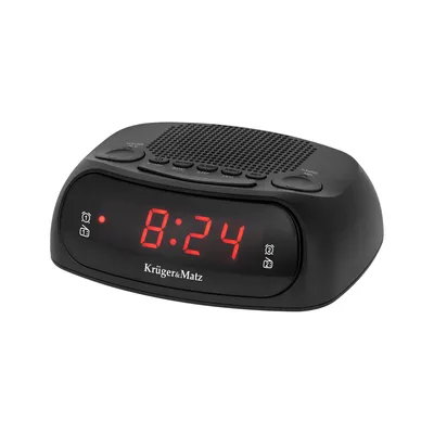 A black Kruger&Matz digital alarm clock with a red LED display showing 8:24.
