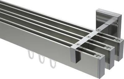 A close-up, angled view of a multi-track curtain rod system.