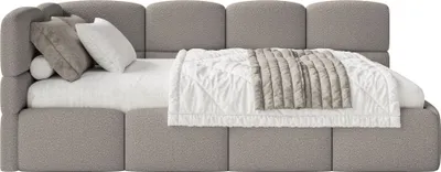 A bed with pillows and a blanket.