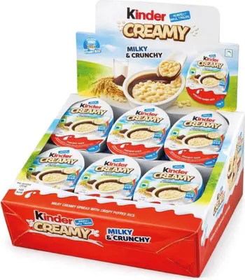 A display box of Kinder Creamy products.