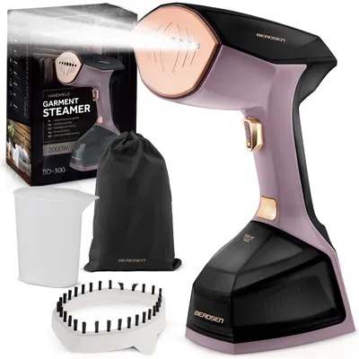 A handheld garment steamer and its accessories are displayed against a white background, with a box in the background.