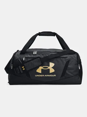 A black and gold Under Armour duffel bag is shown against a light gray background.
