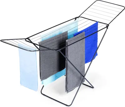 A black metal drying rack with several towels hanging on it, shown against a white background.