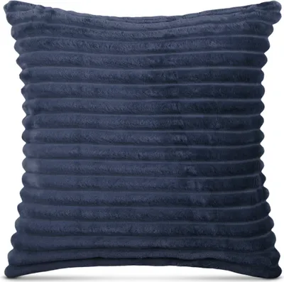 A close-up studio shot of a navy blue corduroy pillow.