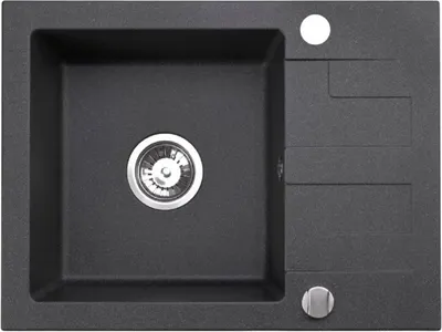 A top-down view of a black granite kitchen sink with a drainer and a silver drain.