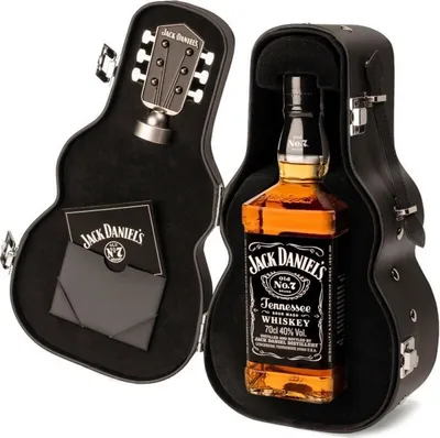 A bottle of Jack Daniel's whiskey is presented in a black guitar-shaped case, which is open.