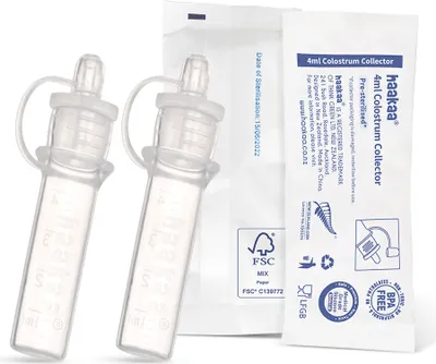 Two Haakaa colostrum collectors are shown next to their packaging.