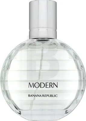 A clear, front-facing studio shot of a round, clear glass perfume bottle with a silver cap.