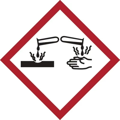 A safety symbol indicating corrosive material.