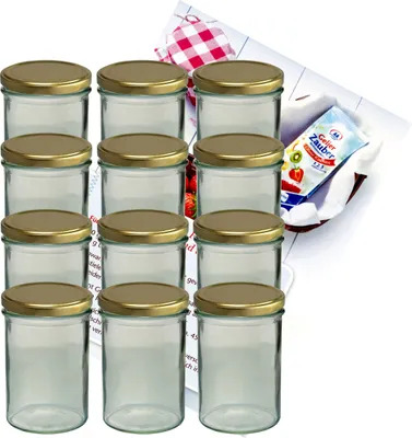 A set of twelve empty glass jars with gold lids, arranged in four rows of three, with a small recipe booklet and a red and white checkered cloth in the background.