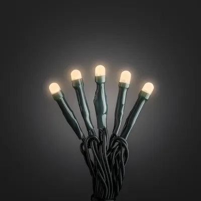 Produktbild von Konstsmide Micro LED Lichterkette, gefrostet, verschweißt, 35 bernsteinfarbene Dioden, 30V Innentrafo, dunkelgrünes Kabel- 6342-820