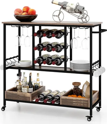 A bar cart filled with wine bottles, glasses, and other bar accessories.
