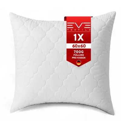 A white quilted pillow with a red tag attached.