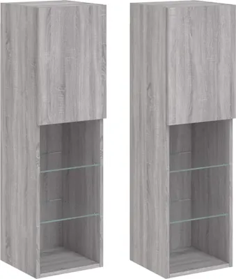 Two identical gray TV cabinets with glass shelves are shown side-by-side against a white background.