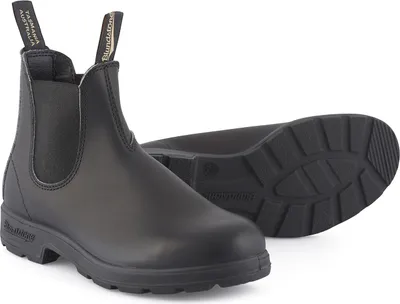 A pair of black Blundstone Chelsea boots on a white background.