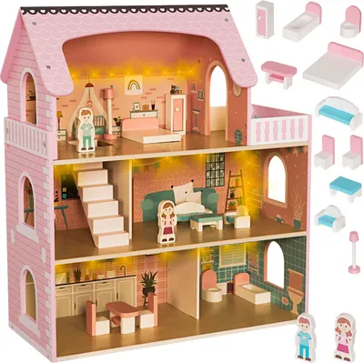 A multi-story wooden dollhouse with furniture and figures, set against a white background.