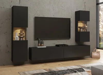 A modern living room setup with a wall-mounted TV and storage units.