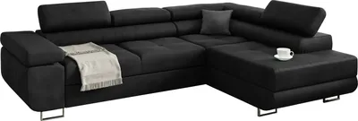 A dark gray sectional sofa with a throw blanket and a coffee cup on a white background.