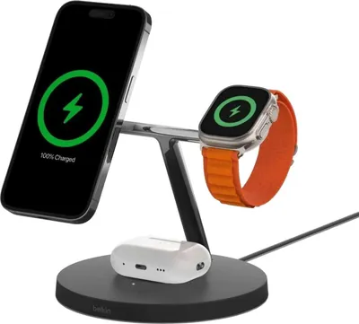 A Belkin MagSafe 3-in-1 wireless charger with an iPhone, Apple Watch, and AirPods Pro charging.