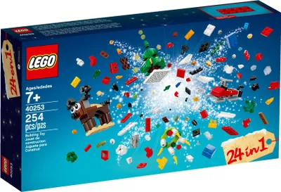 The image shows the packaging of a LEGO set with various small LEGO pieces exploding outwards, along with some built models like a reindeer, a Christmas tree, and a helicopter.
