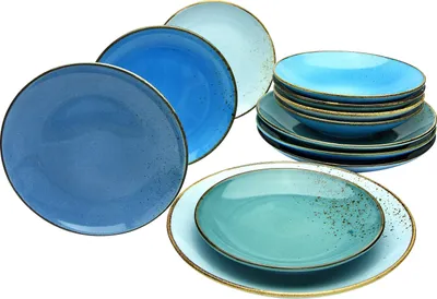 A collection of ceramic plates and bowls in various shades of blue and teal, arranged on a white background.