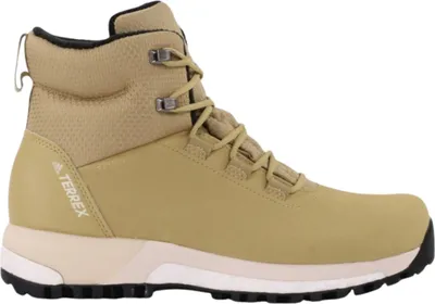 A side view of a beige Adidas TERREX hiking boot.