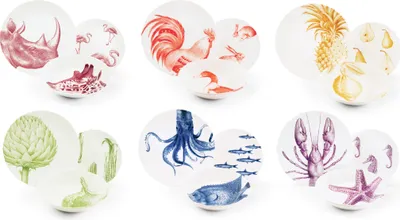 A collage of multiple ceramic plates and bowls, each featuring a different animal or plant illustration.