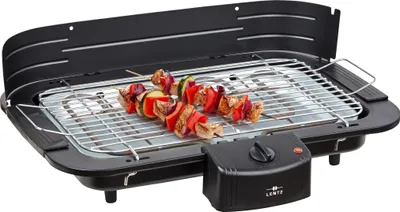 An electric table grill with skewers of food on the grill.
