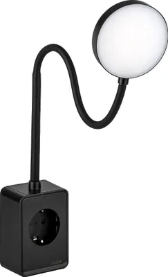 A black LED plug-in lamp with a flexible neck and a round light head is shown against a white background. The base of the lamp has an integrated electrical socket.